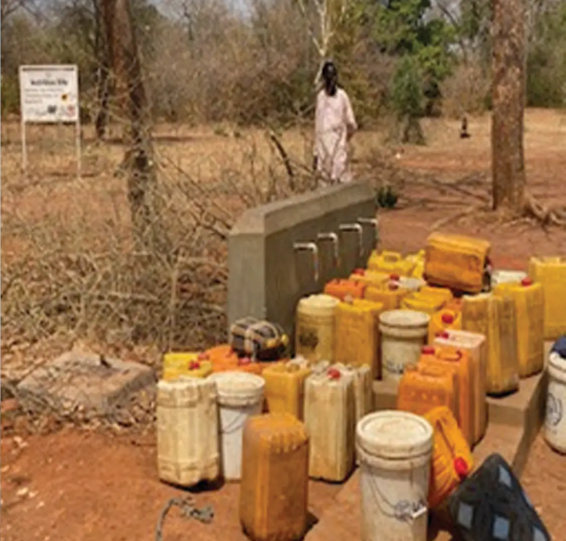 Residents collecting water from the Abuyung tap stand