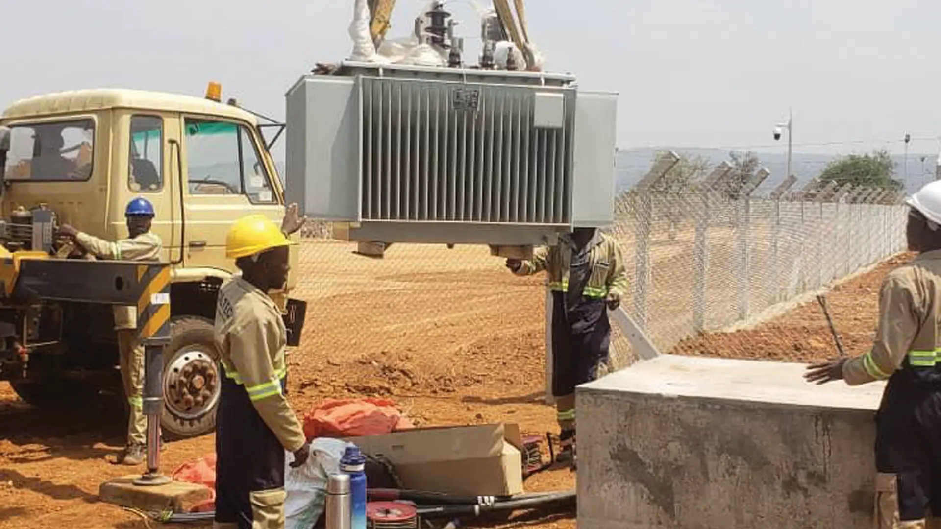 Transformer being lifted into position during installation